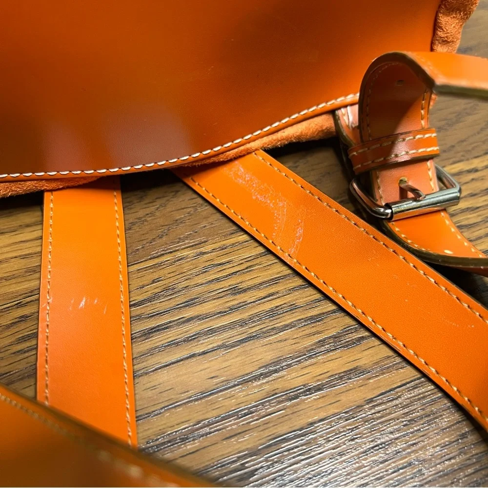 Tommy Hilfiger backpack in orange and brown with a monogram logo print